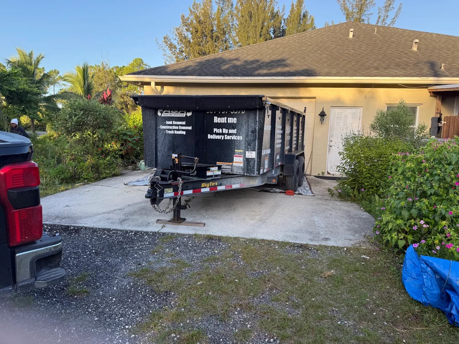 Dump trailer parked in a home driveway
